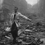 image for The real meaning of "Keep calm and carry on." Milkman during the London blitz 1940.