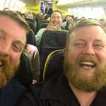 image for Two strangers sit next to each other on a flight and meet their doppelganger