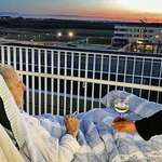image for Old man gets hes last wish fulfilled, a cigarette and a glass of wine on the roof of the hospital.