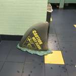 image for This wet floor sign is a shark fin