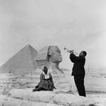 image for Louis Armstrong plays for his wife in front of the Sphinx by the pyramids in Giza, 1961