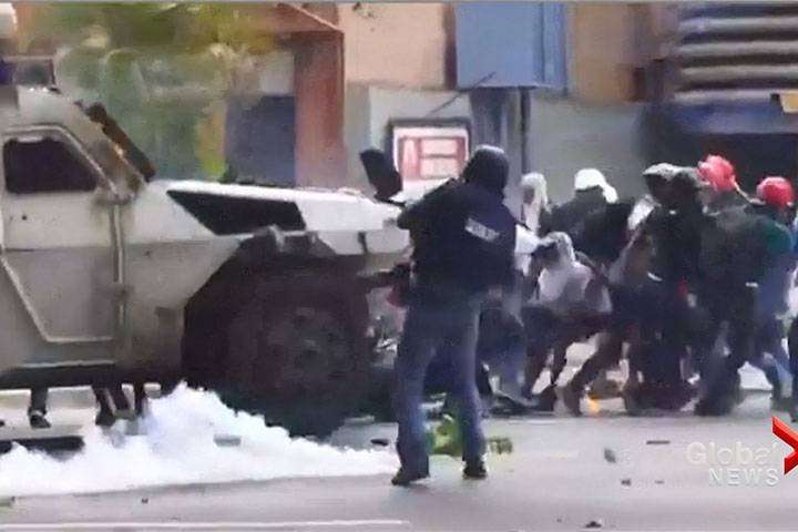 image for Venezuelan tanks plow through crowds as 2-month protest continues