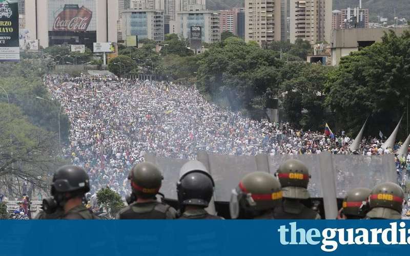 image for Hugo Chávez statue torn down as death toll rises in Venezuela protests