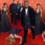 image for Amy Schumer tries to "prank" Kanye West by diving in front of him and pretending to pass out, Kanye reacts by walking away