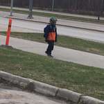 image for Saw this kid casually walking home from school and now he's my new hero