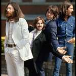 image for The Beatles lining up for the famous "Abbey Road" crosswalk picture -- taken by Linda McCartney (1969).