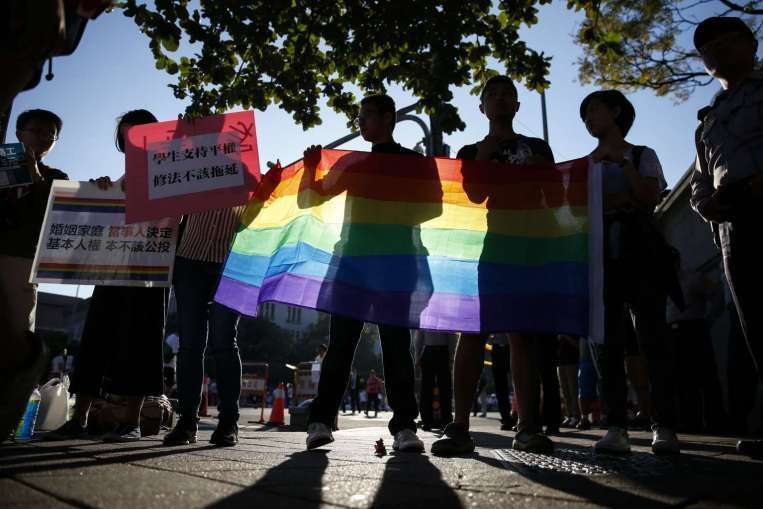 image for Taiwan top court rules same-sex marriage legal, a first in Asia