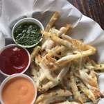 image for [I ate] cheesy garlic herb fries with ketchup, siracha aoli, and pesto dips.