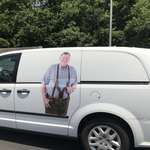 image for This van has a picture of this man on it and nothing else at all