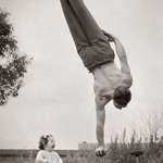 image for Dad showing off his skill to the surprise of his little daughter in Melbourne, Australia ...(circa - 1940)