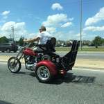 image for This man lost his legs so he built a ramp onto his trike to use his motorized wheelchair to drive it!