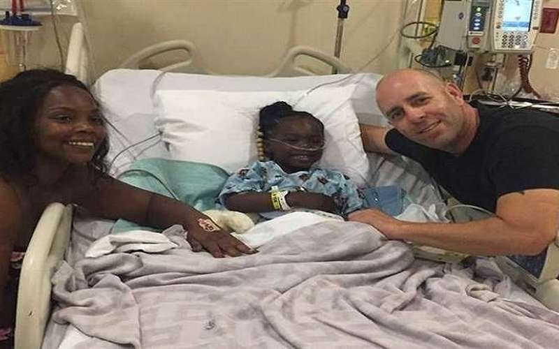 image for Hero reunites with little girl he saved from drowning on her birthday