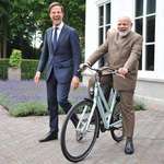 image for PsBattle: India's PM being gifted a bicycle by the Dutch PM