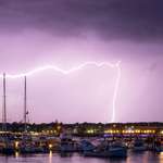 image for Brother spent a year trying to get a lightning photo. He caught this last night, I just noticed the boat in the bottom left.