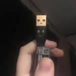 image for My new phone charger cable has a smiley face on it but the USB itself looks mildly displeased.
