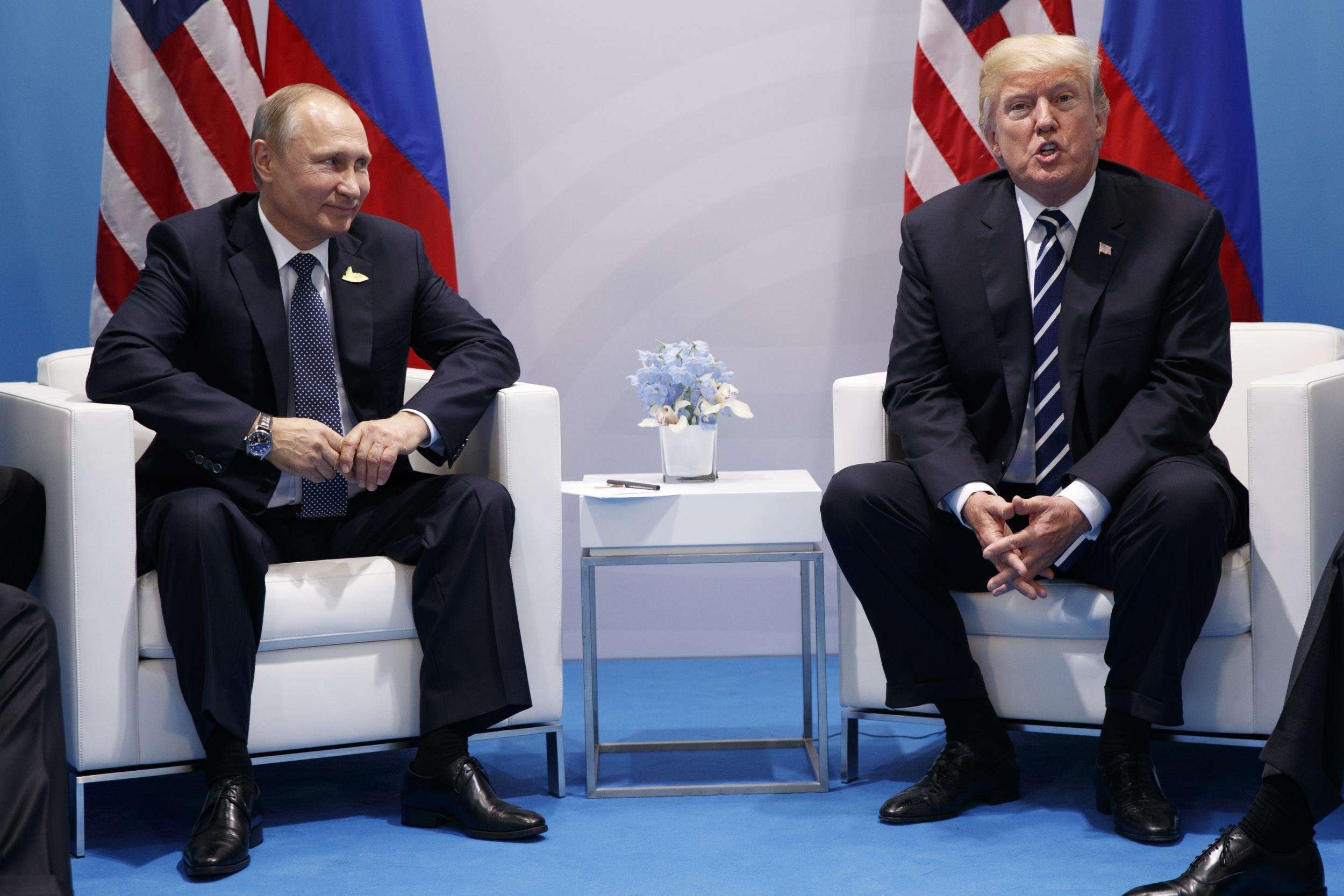 image for Putin points at journalists and asks Trump 'are these the ones hurting you?' during press conference