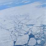 image for Sea ice off the coast of Greenland. Viewed from a Boeing 747 cruising at 38,000 feet. [OC] [2212x2213]