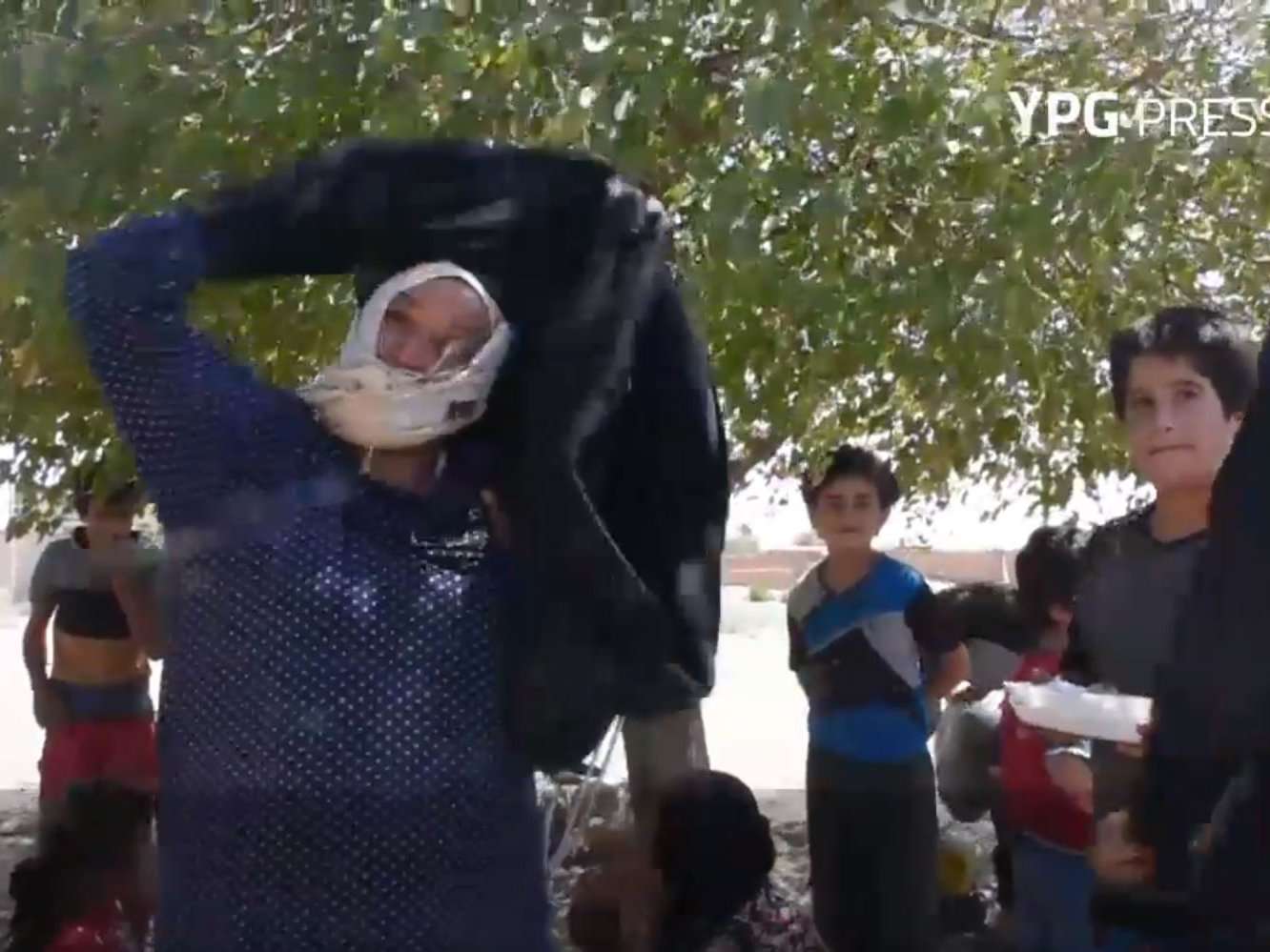 image for Women burn burqas and men shave beards to celebrate liberation from Isis in Syria