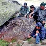 image for Xinjiang meteorite... Chinese researchers measure a huge iron meteorite found in a remote mountainous region in July 2011. The oblong metallic object has an estimated mass of 25 tons or more.