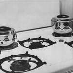 image for The reflection of burners on the pots.