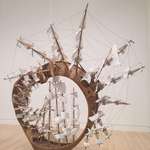 image for Möbius Ship By Tim Hawkinson. Made from wood, plastic, Plexiglas, rope, staples, string, twist ties, glue. 2006