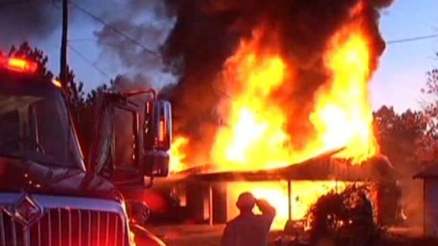 image for Texas authorities: Woman sets snake afire, winds up with burning house