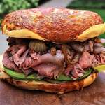 image for Smoked top round roast beef with smoked Gouda, caramelized onions and avocado on an Asiago bagel. [1080 × 985]