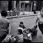 image for A police woman plays duck duck goose with children in Harlem, NYC, New York, US in 1978.