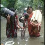 image for 2 women save a dog during a flood in India