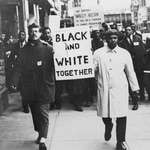image for A white and a black man leading a civil rights march (late 50s to early 60s)