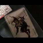 image for At the end of Batman Begins, Batman recieves a joker card from Jim Gordon. This Card was recovered by a policeman named J.Kerr, a common alias of The Joker.