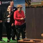 image for Angela Merkel playing Farming Simulator at GamesCom