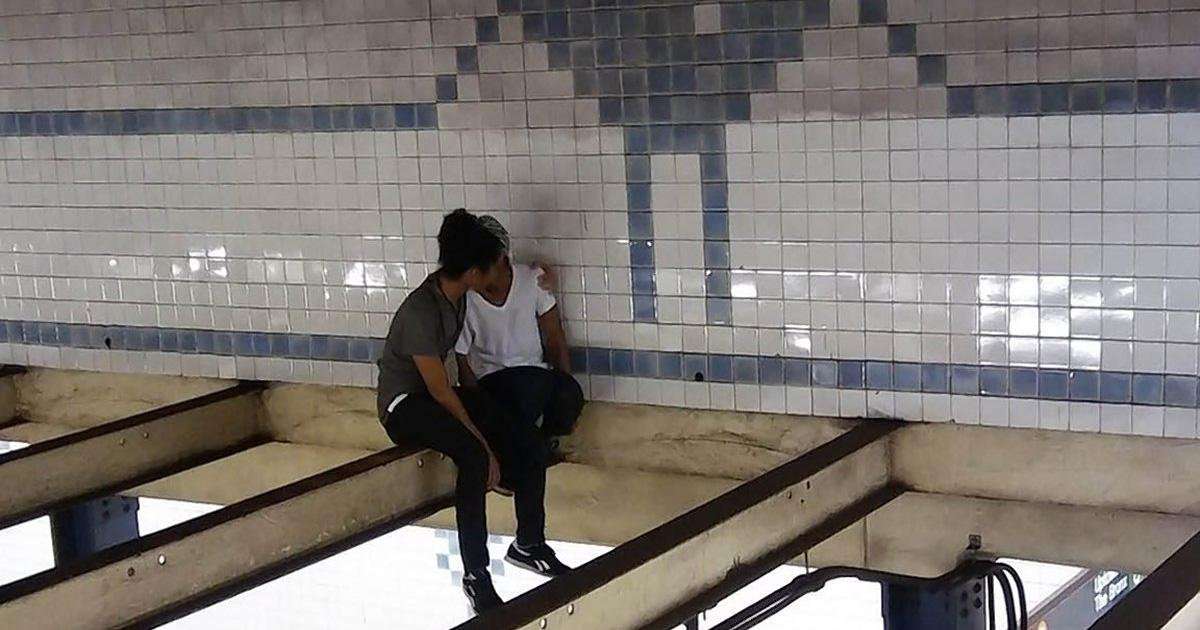 image for Man follows woman onto subway beam, talks her out of jumping