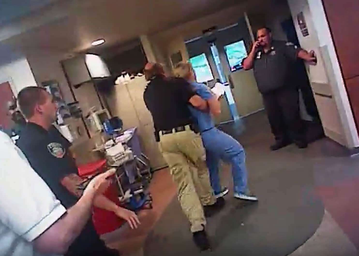 image for The Latest: Officer who arrested Utah nurse put on leave