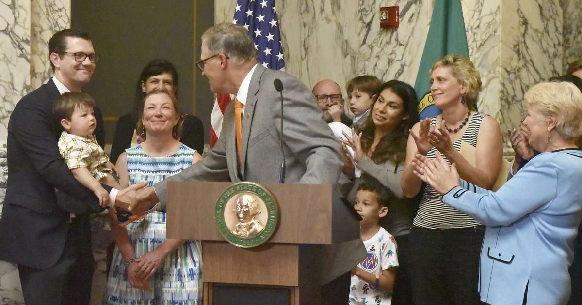 image for Inslee signs bill guaranteeing paid family leave in Washington