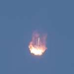 image for I captured a Falcon 9 booster engulfed in its own rocket flame as it descended back to Cape Canaveral for a landing.