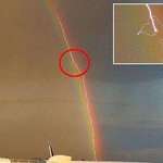 image for Lightning striking a plane inside a rainbow
