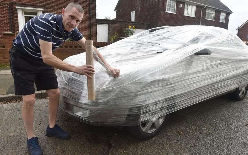 image for Man cling-filmed car because he's sick of people parking outside his house and going on holiday
