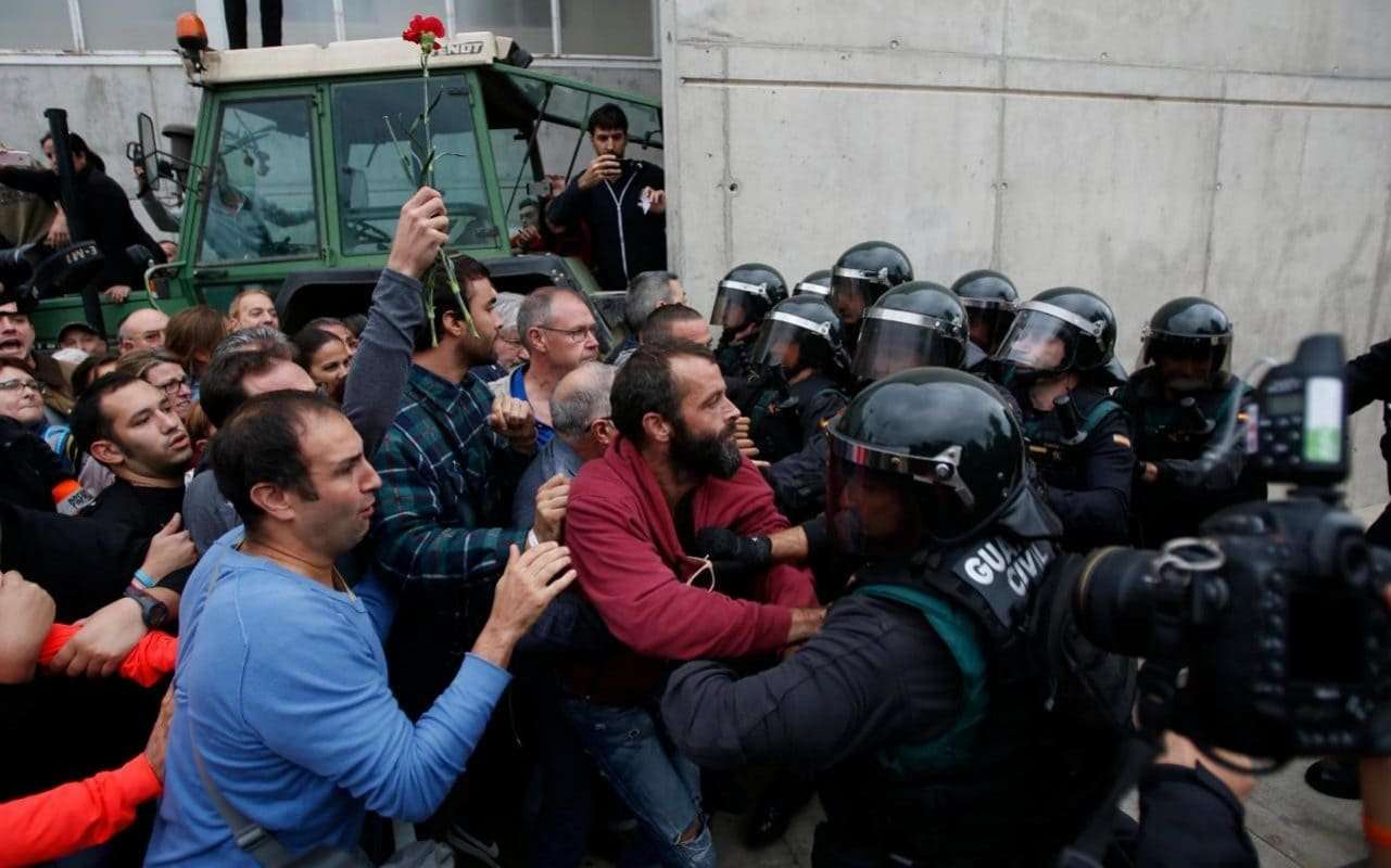 image for Catalan referendum: Riot police 'fire rubber bullets' at crowd as they block voters at besieged polling stations