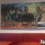 image for This restaurant has a painting of their very first customers.