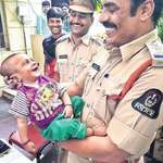 image for Image Of Smiling Baby For Hyderabad Police Officers Who Rescued Him From The Kidnappers Thrill The Internet