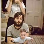 image for Linda McCartney takes a mirror selfie with husband Paul and daughter Mary; London, 1969.