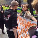 image for PsBattle: girl scout shrugs at a neo-nazi