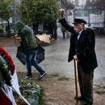 image for Alone in the rain, 95-year-old Greek resistance fighter Manolis Glezos — imprisoned for a total of 12 years, first by the Nazis during WWII, then by the Nazi collaborators after WWII, later by the Colonels during the dictatorship — honors the dead of the 1973 student uprising