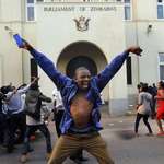 image for PsBattle: This Zimbabwean celebrating the resignation of dictator Robert Mugabe