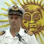 image for This sun giving a shoulder rub to this navy officer.