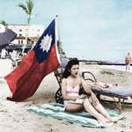 image for Ruth Lee, a hostess at a Chinese restaurant, flies a Chinese flag so she isn’t mistaken for Japanese when she sunbathes on her days off in Miami. Dec. 15, 1941 (Colorized) [2998 x 2392]