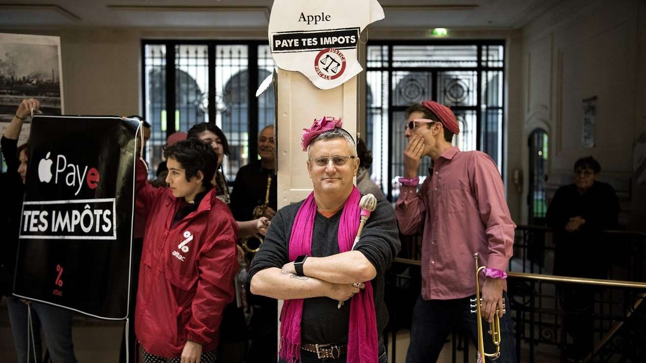 image for Shouting ‘pay your taxes,’ activists occupy Apple retail stores across France