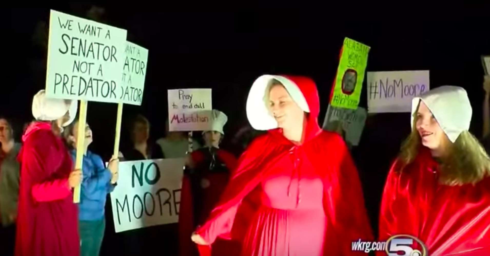 image for Alabama Women Protest Roy Moore By Dressing As Handmaids