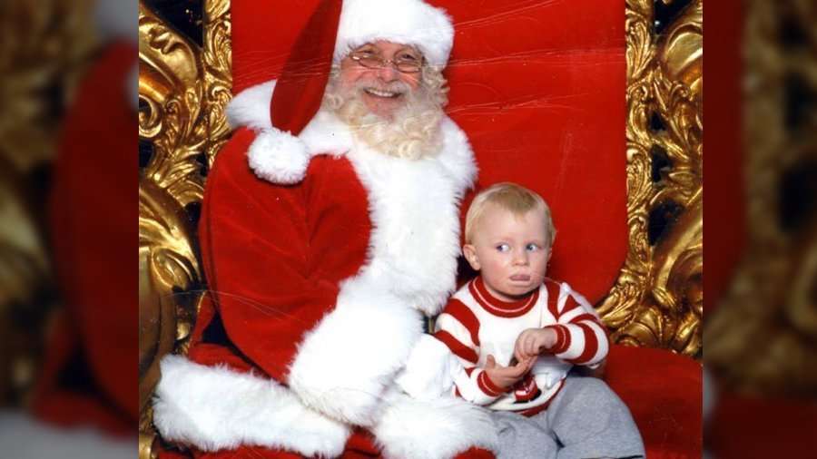 image for Toddler signals ‘help’ in sign language during photo with Santa